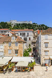Food And Wine Prints: Restaurants and Hvar Fortress, Hvar Town, Hvar, Dalmatian Coast, Croatia, Europe