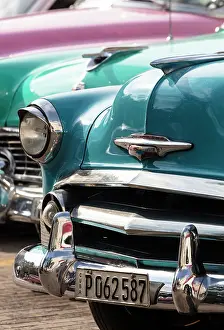Classic Prints: Detail of restored classic American cars waiting to take tourists on city tour