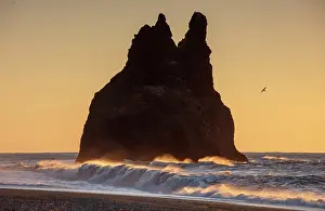 Vik Y Myrdal Prints: One of the Reynisdrangar rock stacks at sunrise