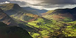 Serene Landscape Prints: Rich autumn sunlight illuminates Newlands Valley in the Lake District, Cumbria, England