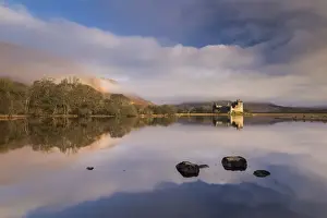 Loch Awe Prints: Rich morning sunlight illuminates Kilchurn Castle on a reflective Loch Awe