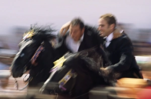 C Ulture Gallery: Two riders on horseback perform the correr abracats