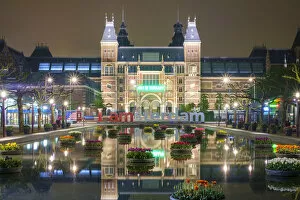 Rijksmuesum and Museumplein illuminiated at night, Amsterdam, North Holland, Netherlands