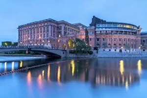 Riksbron Bridge and Parliament House (Riksdagshuset) along Norrstrom river at dusk