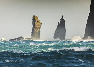 Rough Prints: Risin og Kellingin sea stacks hit by rough ocean. Eysturoy, Faroe Islands