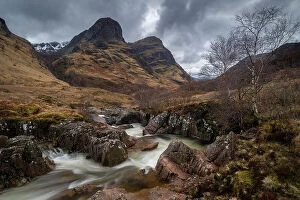 Images Dated 12th June 2023: River Coe rushing through Glencoe valley beneath the Three Sisters mountains, Highlands, Scotland