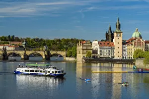 Images Dated 11th May 2017: River cruise boat on Vltava River with Smetana Museum and Charles Bridge in the background