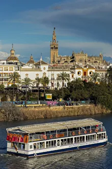 River Guadalquivir with Cathedral and Giralda bell tower in the background, Seville River Guadalquivir with Cathedral and Giralda bell tower in the background, Seville