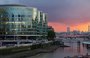 Off Ice Prints: The River Thames in London seen from Tower Bridge with the modern office buildings in front of the City Hall