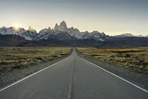 Chalten Prints: Road leading to El Chalten, with Fitz Roy range in the background at sunset