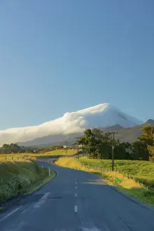Volcanic Cone Prints: Road to the Taranaki volcano in New Zealand northern island on a sunny day