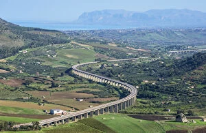 Road withs curve going through mountain landscape, Sicily, Trapani province, Sicily
