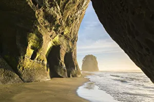 Tunnel Prints: Rock cave and Elephant Rock in the background. Tongaporutu, New Plymouth district