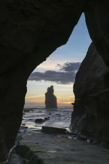 Tongaporutu Prints: Rock cave with low tide at the Three Sisters