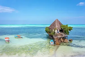Clear Prints: The Rock is a unique ocean restaurant nestled on the shores of Michamvi Pingwe Beach in Zanzibar