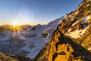 Alpinism Prints: The rocks of Dirrunhorn and glacier of Nadelhorn peak at sunrise from Nadelgrat ridge