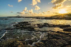 Dramatic Sky Prints: Rocks washed by the Indian Ocean lit by sunset, Trou d Eau Douce, Flacq district