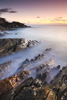 South Hams Prints: Rocky coast at Sunset, Leas Foot Sand, Thurlestone, South Hams, Devon, England. Winter