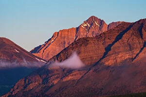 Images Dated 5th June 2023: Rocky Mountains at sunrise with fog patches. Waterton Lakes National Park, Alberta, Canada