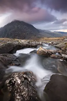 North Wales Prints: Rocky river in Cwm Idwal leading to Pen yr Ole Wen Mountain at sunset