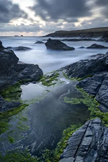 Rocky seashore of Boobys Bay at dusk, Cornwall, England. Summer (August) 2019