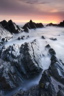 Rocky shores at Hartland Quay at sunset, North Devon, England. Spring (May) 2010