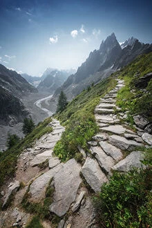 French Alps Gallery: A rocky trail goes up in the mountains from the famous Mer de Glace above Chamonix. French Alps