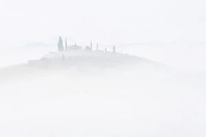 B And W Collection: Rolling hills of Tuscany, with Poggio Istiano rising just enough through the thick layer of fog