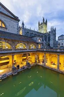 Bath Prints: The Roman Baths and Bath Cathedral illuminated at dusk, Bath, Somerset, England