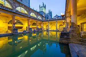 Images Dated 19th August 2019: The Roman Baths and Bath Cathedral illuminated at dusk, Bath, Somerset, England