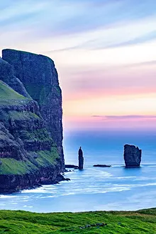 Time Of Day Prints: Romantic sky at sunset over Risin and Kellingin sea stacks washed by ocean waves