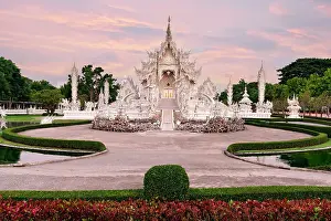 Symmetry Prints: Romantic sunrise over Wat Rong Khun or White Temple buddhist shrine, Chiang Rai, Thailand