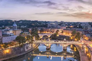 Street Lights Prints: Rome, Lazio, Italy. High angle view of the Roman bridges over the tiber river at dusk