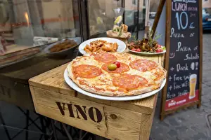 Pizza Prints: Rome, Lazio, Italy. Pizza with raw mean outside a traditional restaurant