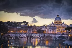 Images Dated 30th January 2015: Rome, Lazio, Italy. Sunset on Tevere River, with Saint Peter Cathedral on the background