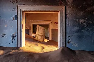 Luderitz Prints: Rooms full of sand and suspended door in abandoned diamond mining town of Kolmanskop