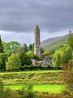 Grassland Collection: The Round Tower at sunset, Early Medieval Monastic Settlement, Glendalough, County Wicklow, Ireland