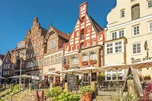 Luneburg Prints: Row of houses at Am Stintmarkt with outdoor terraces, Luneburg, Lower Saxony, Germany