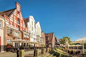 Luneburg Prints: Row of houses at Am Stintmarkt with outdoor terraces, Luneburg, Lower Saxony, Germany