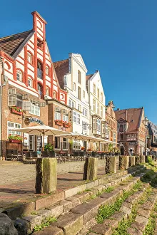 Lower Saxony Prints: Row of houses at Am Stintmarkt with outdoor terraces, Luneburg, Lower Saxony, Germany