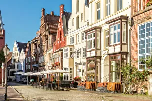 Luneburg Prints: Row of houses at Am Stintmarkt with outdoor terraces, Luneburg, Lower Saxony, Germany
