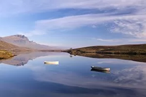 Images Dated 4th November 2015: Rowing boats on Loch Fada, with the Old Man of Storr beyond, Isle of Skye, Scotland