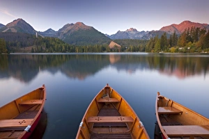 Slovakia Prints: Rowing boats and mountains beneath a twilight sky, Strbske Pleso Lake in the High Tatras