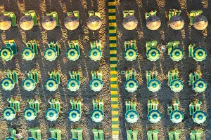 Gargano Prints: Rows of striped multi colored beach umbrellas and its shadows from above, Vieste
