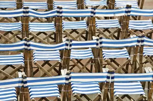 Images Dated 10th August 2011: Rows of traditional blue and white deckchairs, Eastbourne, Sussex, UK