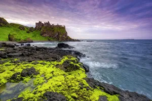 Coastal Landscape Prints: Ruins of Dunluce castle at sunset