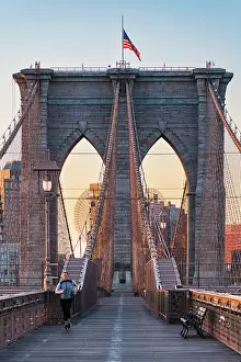 running on New York City Brooklyn Bridge at Sunrise, USA