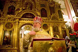 Custom Prints: Russia; St. Petersburg; The High Priest talking to believers during the Russian Orthodox Easter ceremony