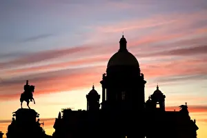 Sun Set Prints: Russia, St. Petersburg; St. Isaacs Cathedral in silhoutte against a dramatic eveing light with the Tsar Nicholas