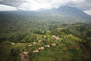 Rwanda. The luxurious Virunga Safari Lodge sits below looming volcanoes